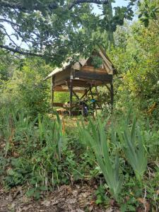 a bird house in the middle of a field at Cabane Le Nid - CANAL DU MIDI in Carcassonne