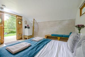 a bedroom with a bed and a table and a window at 1 Bed in Bude oc-s34856 in Bude +14 photos