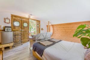 a bedroom with a white bed and a tv at 1 Bed in Bude oc-s34849 in Bude