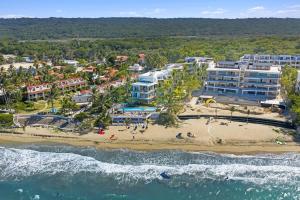 an aerial view of the beach at a resort at 3BR Beachfront Private Pool Ultravioleta Cabarete in Cabarete +45 photos