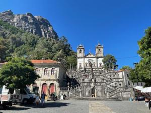 an old building with a mountain in the background at Maison Casa Nord du Portugal Gères in Arcos de Valdevez +5 photos