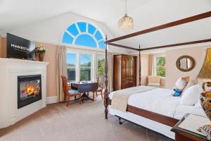 a bedroom with a bed and a fireplace at St. Croix Valley Inn in Shafer