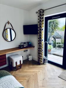 a bedroom with a sliding glass door to a patio at Barnfield house in Upham