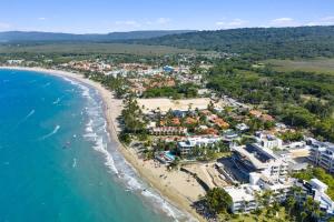 an aerial view of a resort on the beach at Luxury 3BR Beachfront Private Pool Ultravioleta in Cabarete