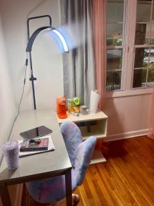 a room with a desk with a chair and a lamp at Bankston A in Marietta