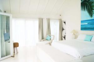 Tempat tidur dalam kamar di Harmony Villas