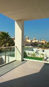 a balcony with a view of a resort at Home Sweet Home in Abu Dhabi