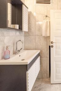 a bathroom with a sink and a shower at Güneş Villa in Antalya +36 photos