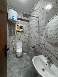a bathroom with a white toilet and a sink at Villa Solla Dahab in Dahab