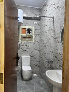 a bathroom with a toilet and a sink at Villa Solla Dahab in Dahab +15 photos