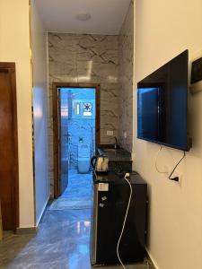 a hallway with a bathroom with a television on a wall at Villa Solla Dahab in Dahab