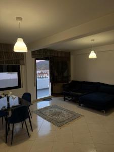a living room with a couch and a table at Étoile in M'diq +21 photos