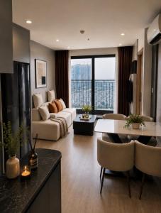 a living room with a couch and a table at Ocean Nest - 2BR Apartment in Ocean Park in Gia Lâm Pho