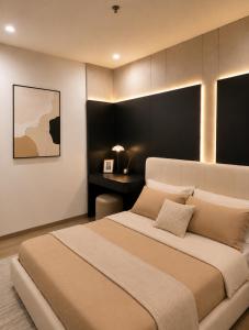 a bedroom with a large bed and a desk at Ocean Nest - 2BR Apartment in Ocean Park in Gia Lâm Pho +19 photos