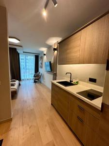 a kitchen with a sink and a counter top at Eleve Residences - Sand Studio in Sofia