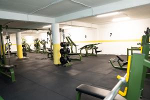 a gym with a bunch of equipment in a room at Hotel Han Gusinje in Gusinje