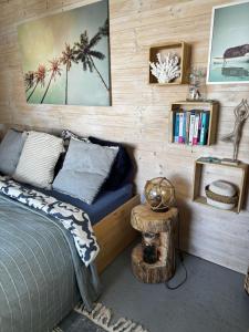 a bedroom with a bed and a table with a bed sidx sidx sidx at The Marina Treehouse in Hamuliakovo +10 photos