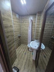 a bathroom with a shower and a toilet and a sink at Green House in Ureki +11 photos