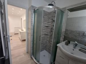 a bathroom with a shower and a sink at Da Fede al mare in Moneglia +23 photos