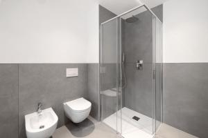 a bathroom with a shower and a toilet and a sink at La Casetta di Cannero by Residenza La Zagara in Cannero Riviera +32 photos
