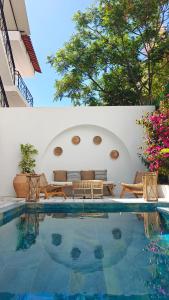 a house with a swimming pool in a yard at VILLA MARGARIT Boutique Hotel in Sarandë