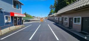 an empty street between two buildings in a town at Farwest Motel in Everett