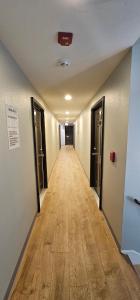 an empty hallway with a long hallway with doors at Farwest Motel in Everett