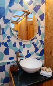 a bathroom with a sink and a mirror at Glamping mágico en el Bosque in Oicatá