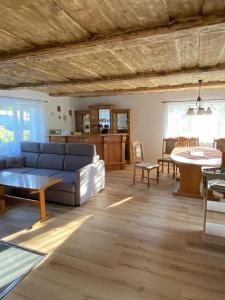 a living room with a couch and a table at Chalupa Abecha in Dolní Poustevna