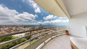 a balcony with a view of the city at Bella Apartment in Fort-de-France