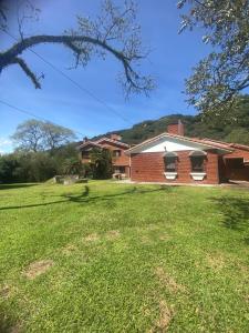 a brick house with a large yard in front of it at la casona de yala in Yala