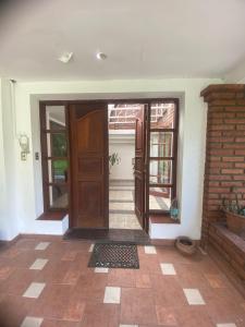 an entrance to a house with a door and a brick wall at la casona de yala in Yala