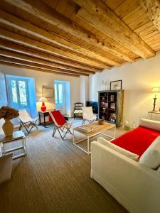 a bedroom with a bed and chairs in a room at ValTho Orelle Le Paradis Blanc in Orelle