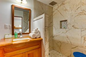 a bathroom with a sink and a shower at Spacious Beachfront Family Home w Caribbean Views in Maya Beach