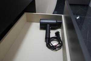 a black flashlight sitting in a box at Arabia Suites in Cosenza +22 photos