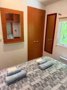 a bedroom with a bed with two pillows on it at Horizon Marin Escapade bord de mer à Cancale in Cancale