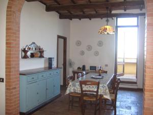 a kitchen with a table and a dining room at Staffolino in Siena