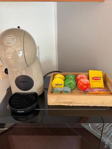 a mixer on a counter next to a cutting board with food at Horizon Marin Escapade bord de mer à Cancale in Cancale
