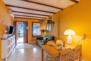 a living room with a table and a couch at Brentano Giardino in Mezzegra +21 photos