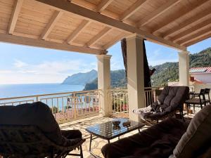 a porch with a view of the ocean at Vicky's Panoramic View Apartments in Pelekas