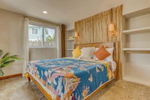 a bedroom with a king sized bed with a large window at Luxury Waterfront 3bd Villa w Pool Dock in Maya Beach
