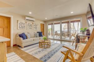 a living room with a couch and a table at Luxury Waterfront 3bd Villa w Pool Dock in Maya Beach