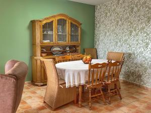 a dining room with a table and chairs at Villa Cala Encantada Sea View Apartments with Pool in Calpe