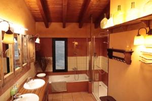 a bathroom with a tub and a sink and a shower at Cal Riol in Talarn +27 photos