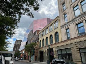 a group of buildings on a city street at Downtown Suite with Balcony in Syracuse