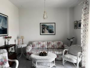 a living room with a couch and chairs at Ellis house Agnanti in Kalives Poligirou