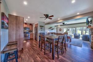 a kitchen and dining room with a table and chairs at Tahoe Retreat on the Meadow- Hot Tub AC in South Lake Tahoe