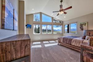 a bedroom with a bed and a ceiling fan at Tahoe Retreat on the Meadow- Hot Tub AC in South Lake Tahoe