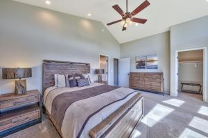 a bedroom with a large bed and a ceiling fan at Tahoe Retreat on the Meadow- Hot Tub AC in South Lake Tahoe