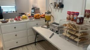 a kitchen with a counter with some food on it at Stardust Hotel in Miami Beach +33 photos